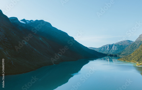 Fototapeta Naklejka Na Ścianę i Meble -  Lovatnet lake and mountains landscape in Norway water reflection morning scenery travel scandinavian beautiful destinations.