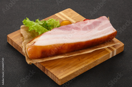 Smoked pork breast with salad leaves