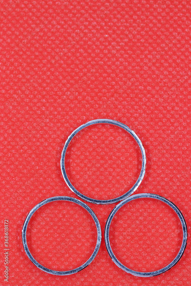 silver three rings with red background silver three rings with red background