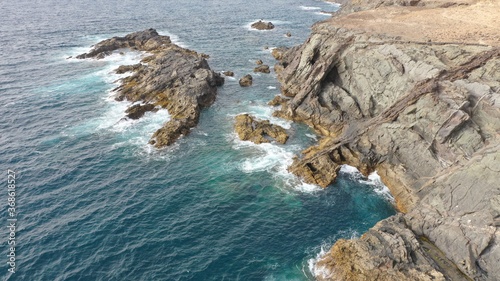 mighty ocean spitting out the cliffs photo