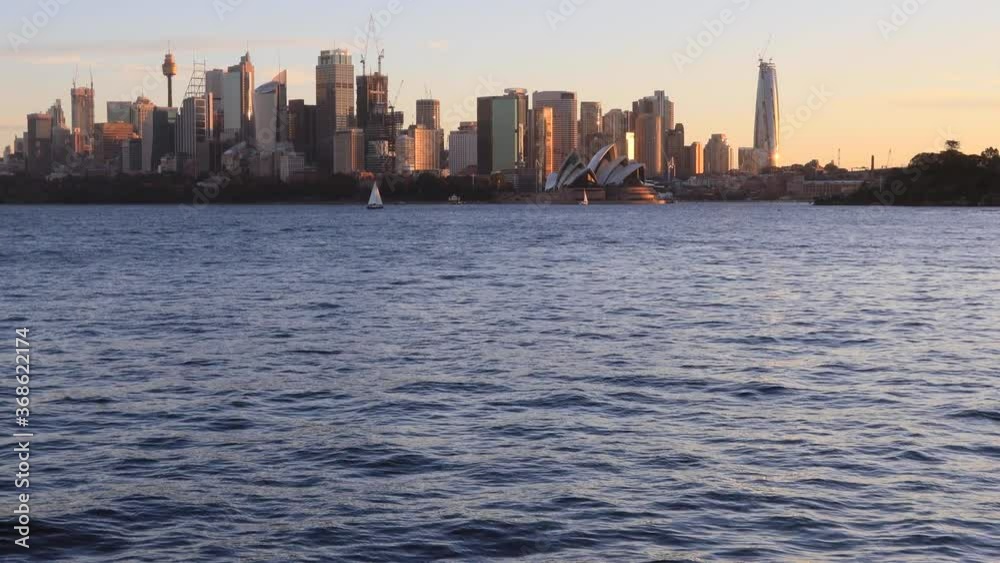 Australia Sydney city Landmarks on Harbour waterfront at sunset in 4k.
Australia Sydney city Landmarks on Harbour waterfront at sunset in 4k.