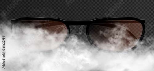 Classic realistic man or woman glasses striking appearance in the thick smoke clouds. Vector 3d illustration isolated on the dark transparent background.  Frontal view with bows.