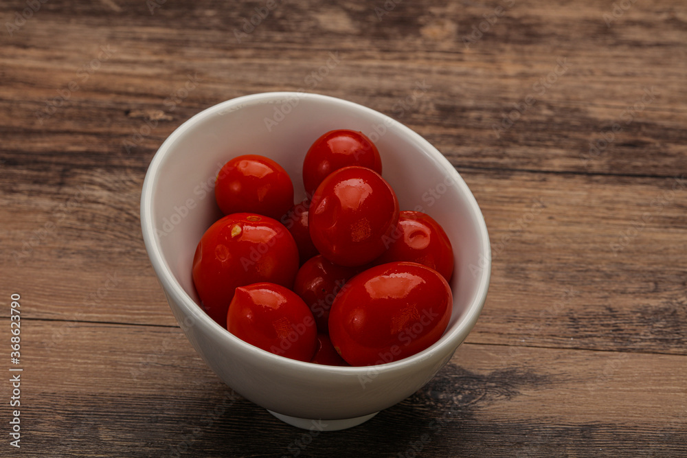 Pickled cherry tomatoes in the bowl Pickled cherry tomatoes in the bowl