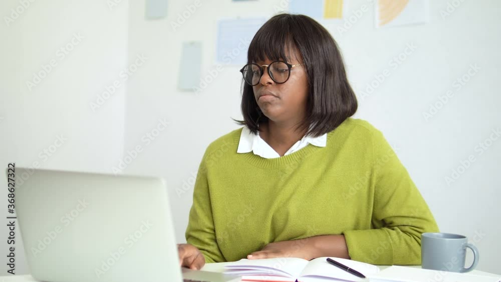 Angry afro-american woman displeased with remarks to work, professional burnout Angry afro-american woman displeased with remarks to work, professional burnout