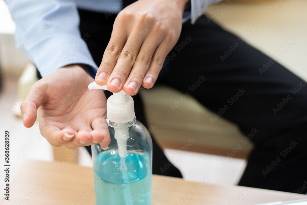 Closeup  hands using alcohol gel for sanitizer anti virus bacteria.