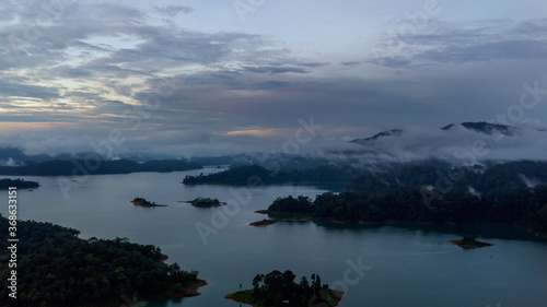 Aerial view of Kenyir Lake during blue hour sunrise.