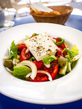 Fresh Greek salad - feta cheese, tomatoes, pepper, lettuce, green olives and onion 