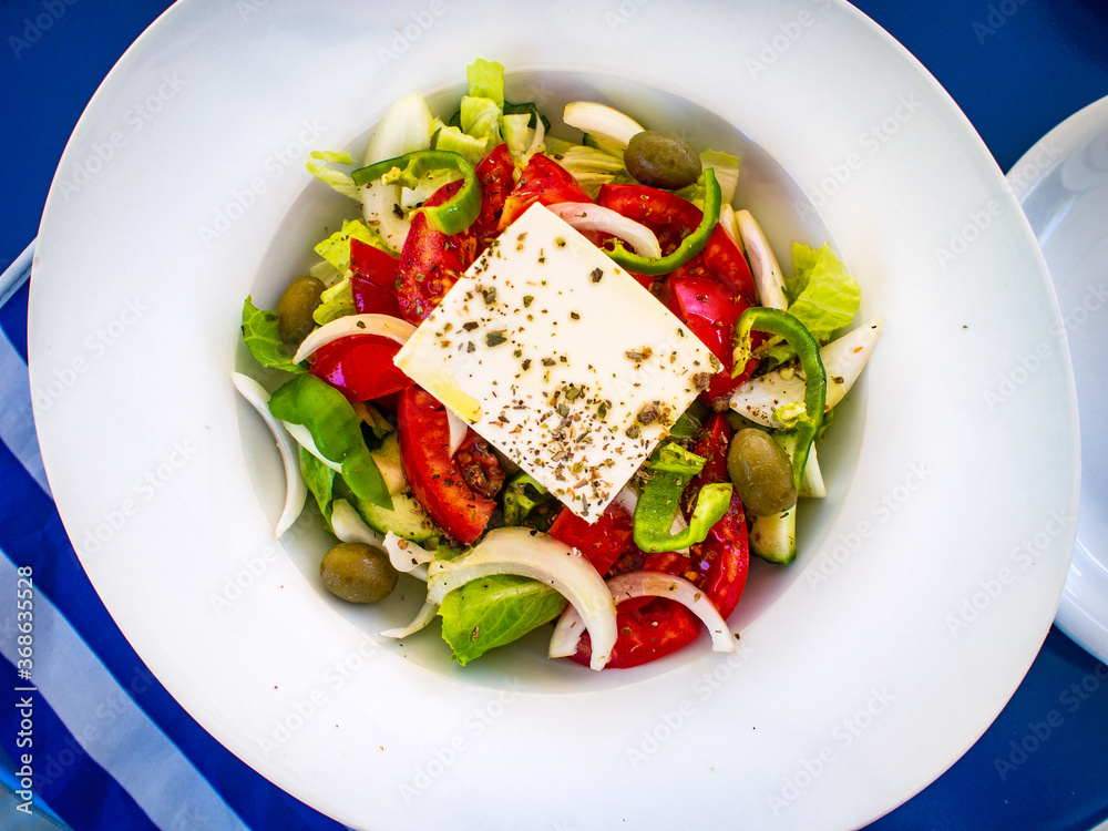 Fresh Greek salad - feta cheese, cherry tomatoes, lettuce, black olives and onion Fresh Greek salad - feta cheese, cherry tomatoes, lettuce, black olives and onion