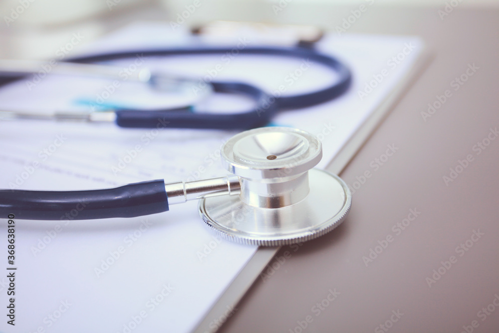 Medical equipment: blue stethoscope and tablet on white background. Medical equipment Medical equipment: blue stethoscope and tablet on white background. Medical equipment
