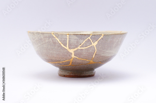 Fotografia, Obraz Antique Beige Japanese kintsugi bowl, restored with gold