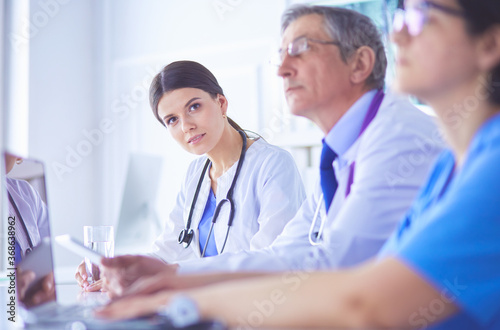 Doctors consulting with each other in a hospital conference room