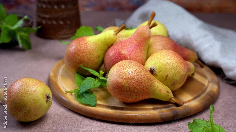 Fresh ripe pears on wooden tray in rustic style Fresh ripe pears on wooden tray in rustic style