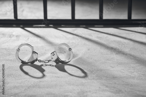 Handcuffs and prison bars background #S2168