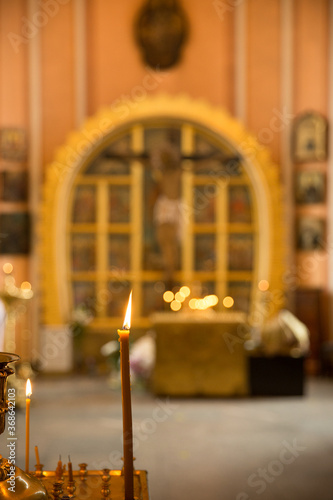 The interior of the Russian Christian church. Candles and icons during the service. Chesme church in the city of St. Petersburg  Russia. Image with selective focus.
