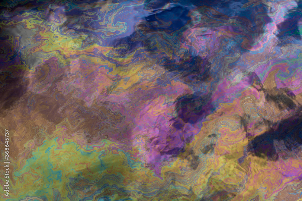 abstract colorful background. multi-colored oil slick on the surface of the water.