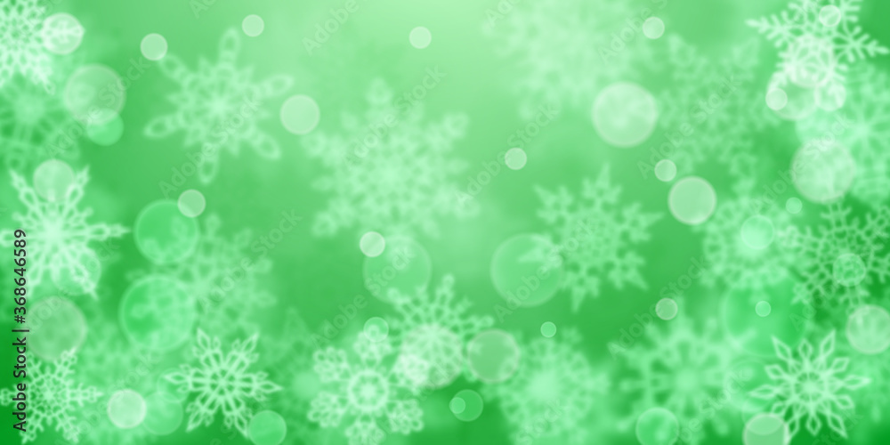 Christmas background of blurry snowflakes in green colors Christmas background of blurry snowflakes in green colors