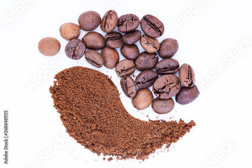 Coffee beans and ground coffee close up isolated on white