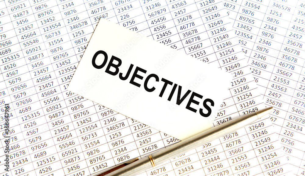 Paper with text objective on wood table Paper with text objective on wood table
