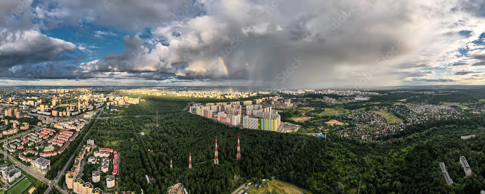 Panorama of modern urban areas near the forest