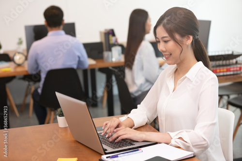 Business asian woman happy working job on laptop in office.