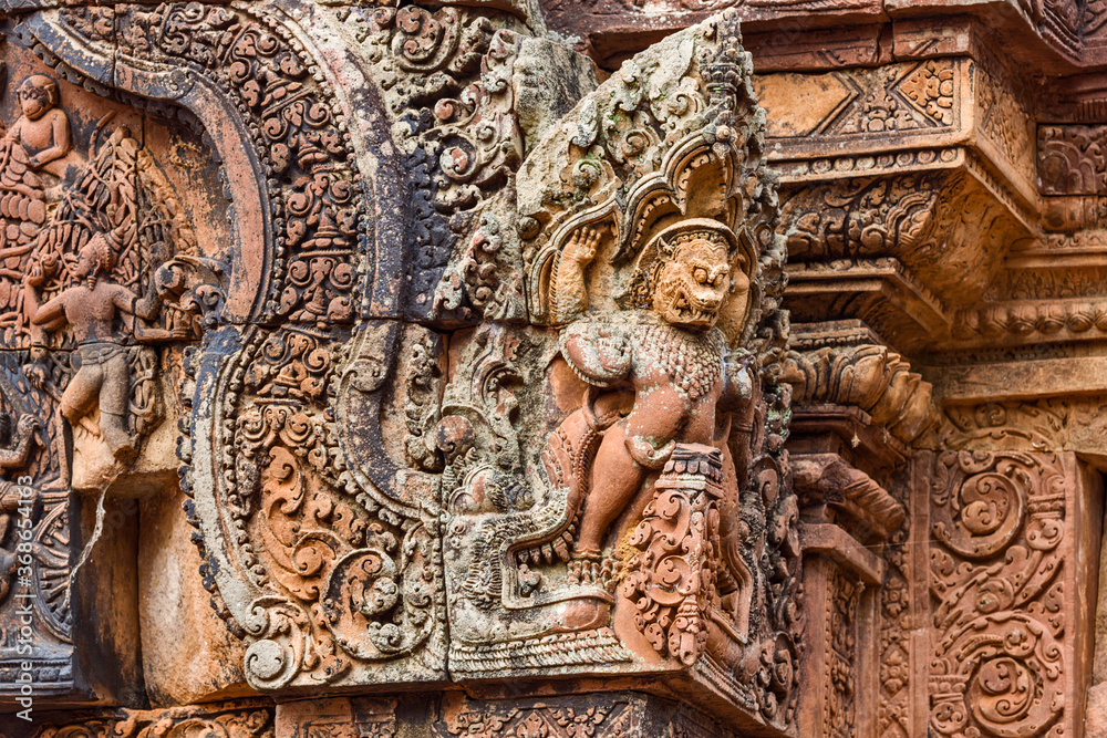 Stone carvings and naga sculpture at Banteay Srei temple at Angkor in Siem Reap, Cambodia