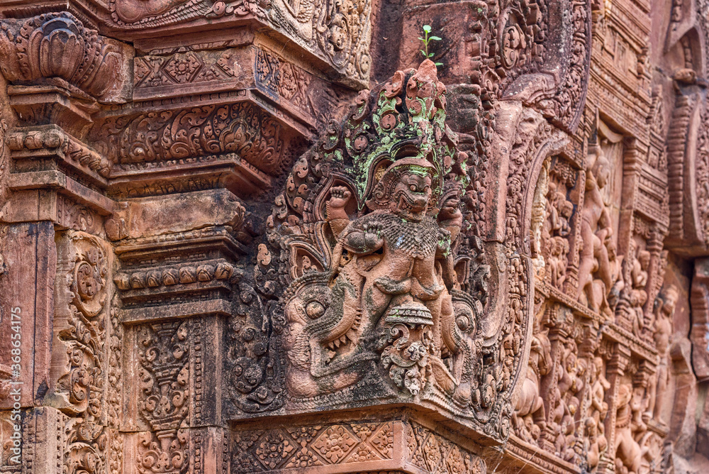 Stone carvings and naga sculpture at Banteay Srei temple at Angkor in Siem Reap, Cambodia