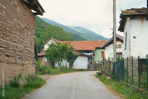 Old traditional village in Stara Planina mountains on a rainy summer day 