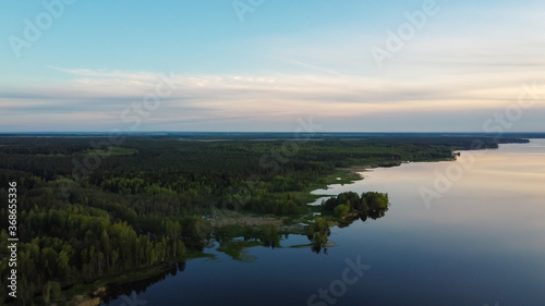 Green shore of the lake. Forest and water meet. View from above © Лилия Люцко