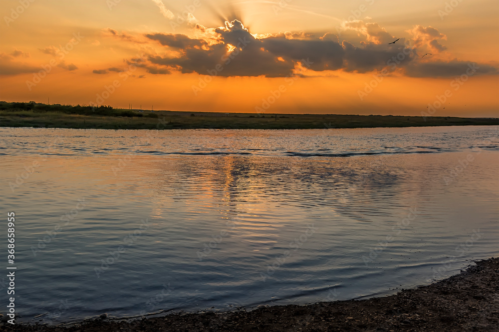 Sunset across the River Glaven at Blakeney, Norfolk, UK Sunset across the River Glaven at Blakeney, Norfolk, UK