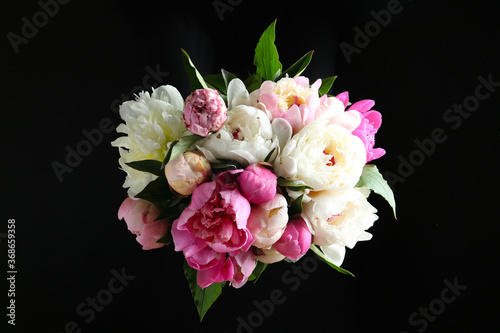 Fototapeta Naklejka Na Ścianę i Meble -  Bouquet of beautiful peonies on black background