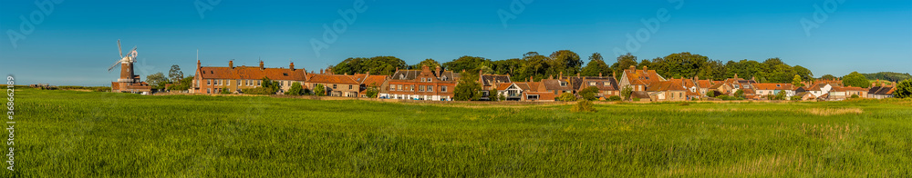 A panorama view across the marshes of the village of Cley, Norfolk, UK