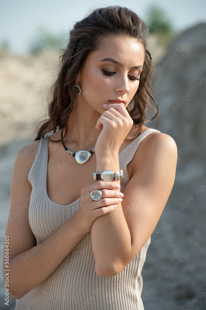 woman showing off her jewelery in fashion concept wearing accessories and jewelry woman showing off her jewelery in fashion concept wearing accessories and jewelry