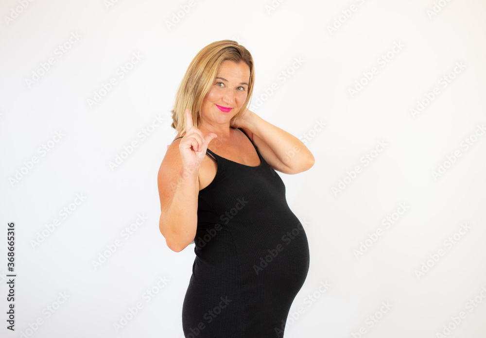 Pretty pregnant woman in black dress with bags Pretty pregnant woman in black dress with bags