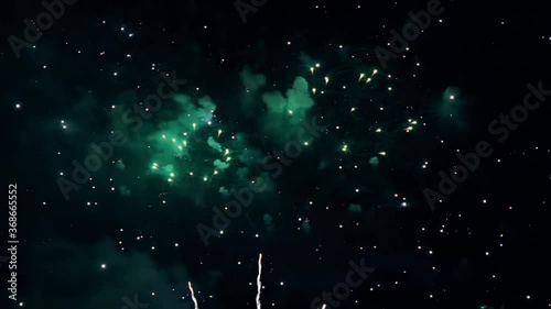 Multi color firework Explosion on a night  sky. Abstract Background for birthday event, anniversary, Party Holiday, Christmas and new year celebration. real golden shining fireworks with bokeh lights.