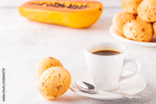 Traditional Brazilian breakfast - cheese bread, coffee, ripe fruit.