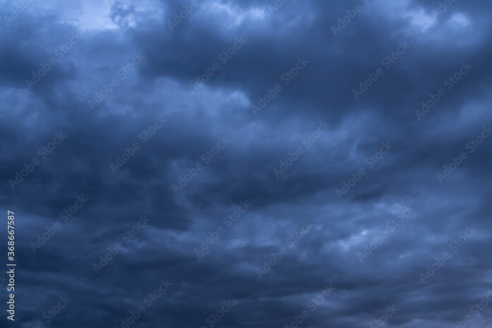 Beautiful dark stormy sky and blue dramatic clouds. Sky background.