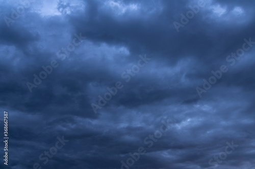 Beautiful dark stormy sky and blue dramatic clouds. Sky background.