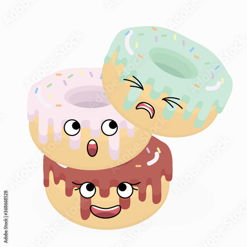 Three cute donuts look at each other while standing in the form of an unstable tower.
