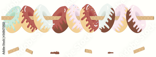 Donuts hanging on a waffle tube. Decoration.