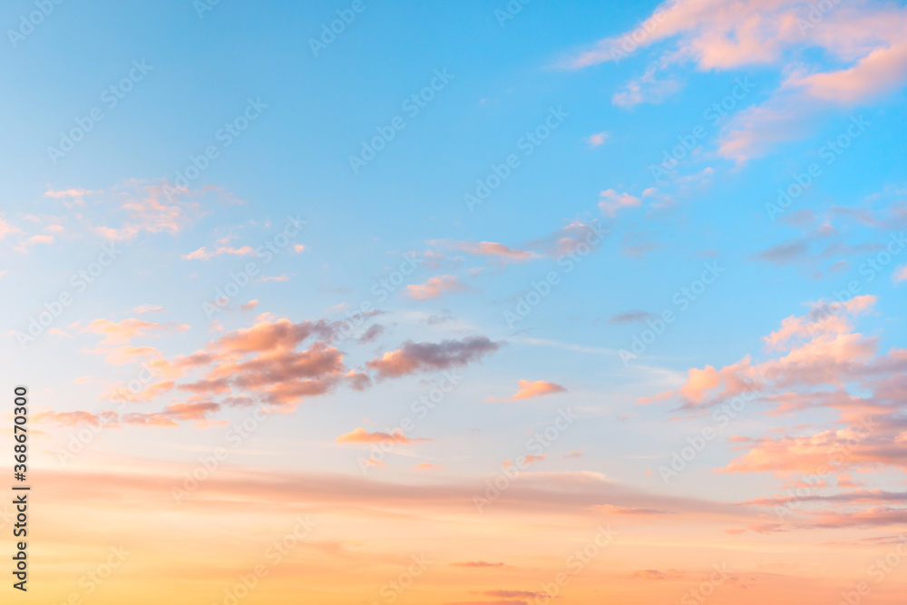 Sunset sky with clouds and red reflections from the sun. Bright colorful background