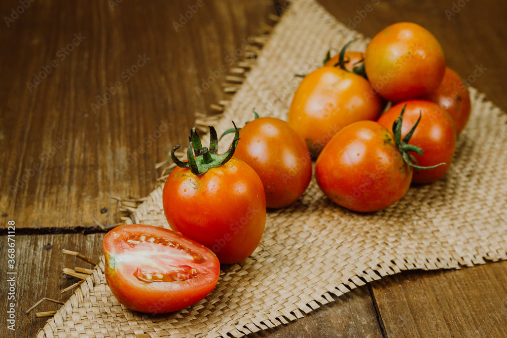 tomatoes on a wooden table tomatoes on a wooden table