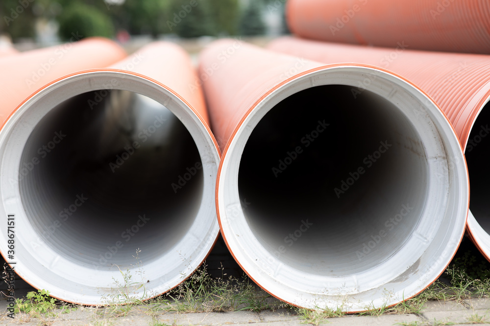 Red plastic pipes at a construction area Red plastic pipes at a construction area