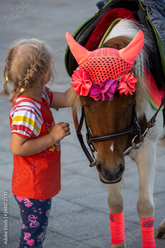 horse and girl in red