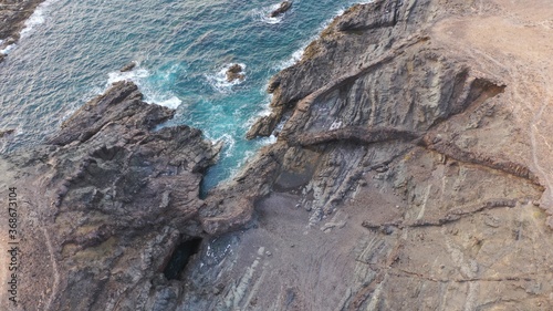 mighty ocean spitting out the cliffs