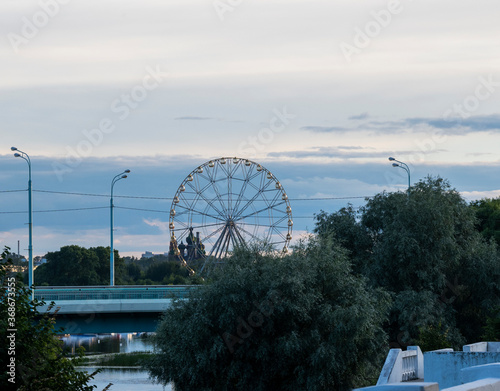 city forest and river at sunset