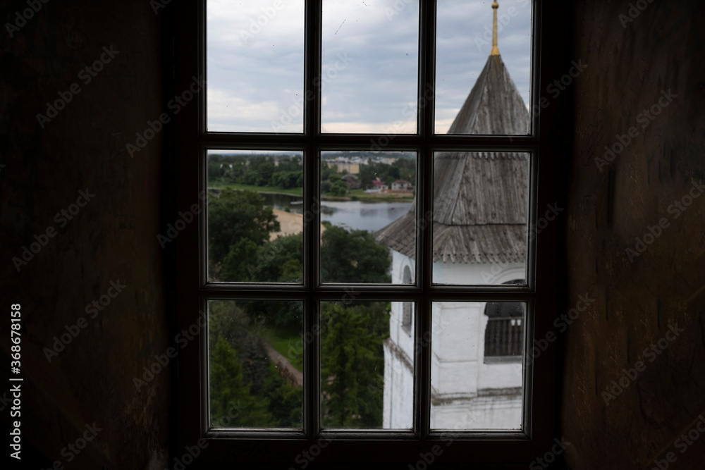 Fototapeta premium old white-stone fortress in the cityscape