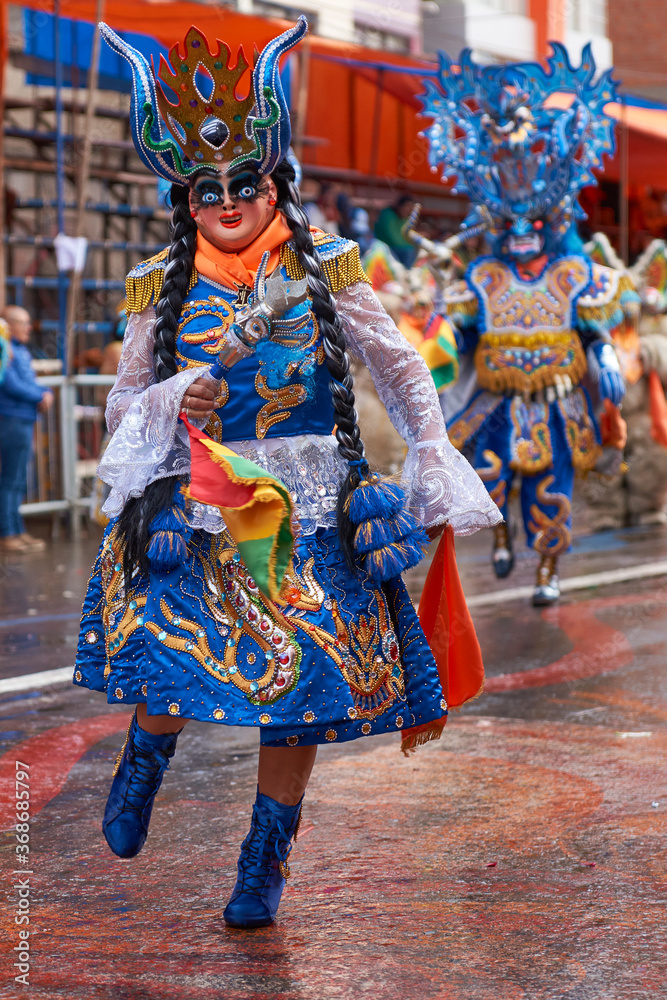 Diablada dancers in ornate costumes parade through the mining city of Oruro on the Altiplano of Bolivia during the annual carnival.