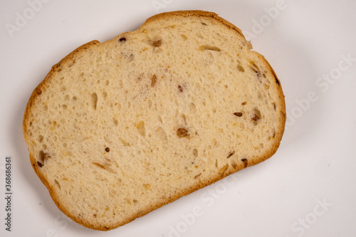 Single slice of multi-grain bread isolated on a white background