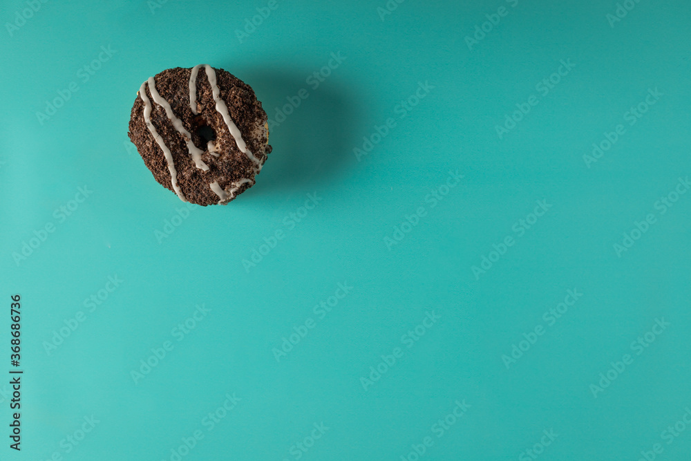 single donut on a blue background single donut on a blue background