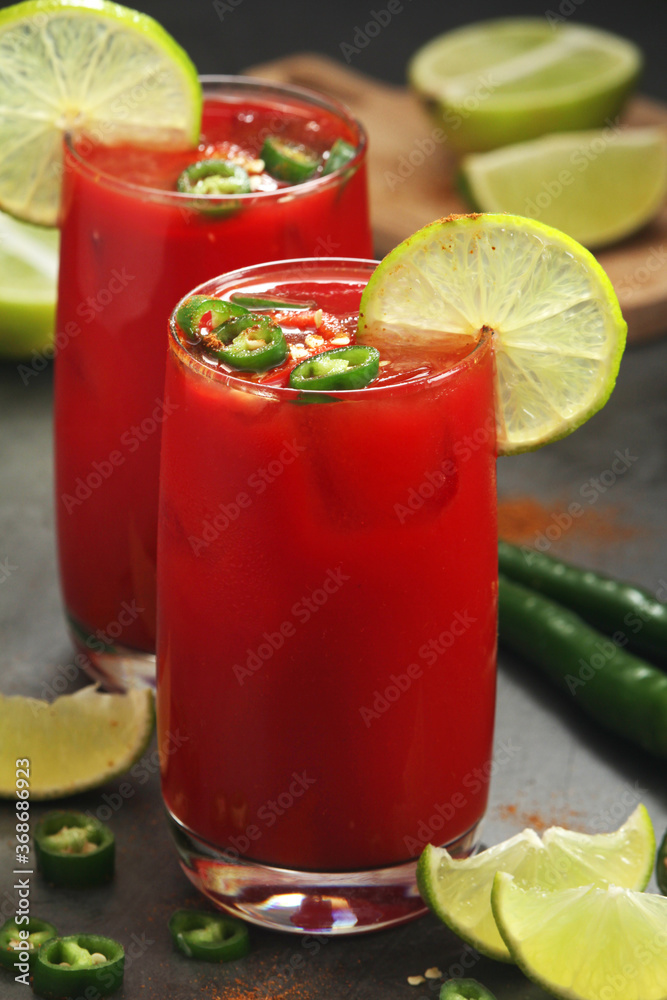Jalapeno tomato margarita cocktail with lime	